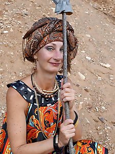 With spear wearing in colorful dress